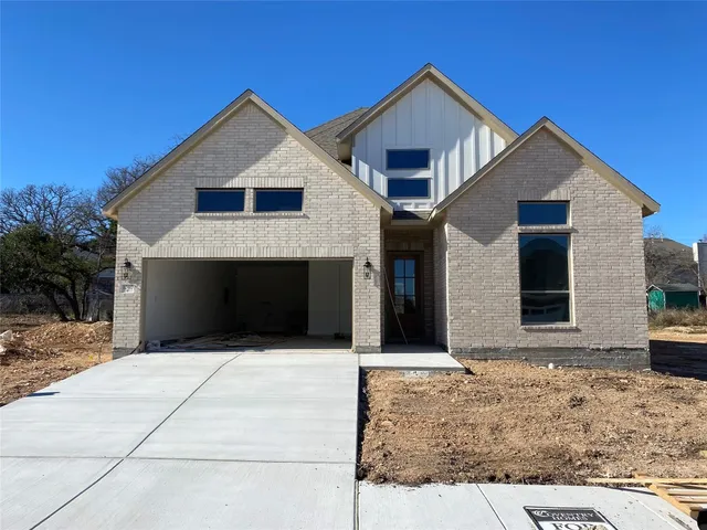 a front view of a house with yard