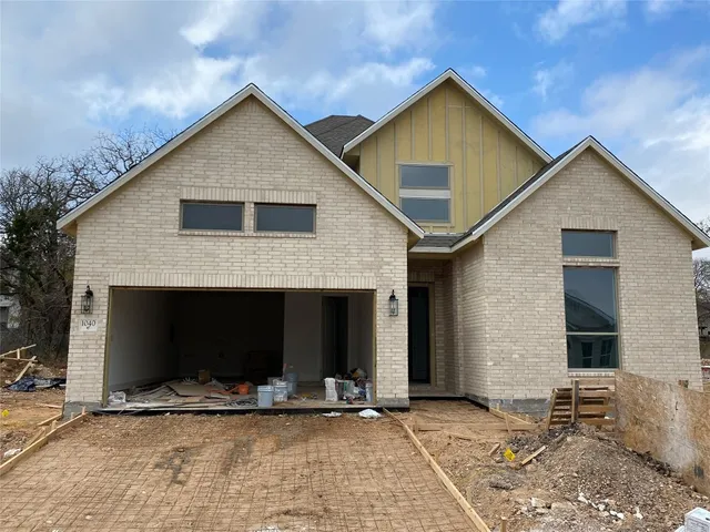 a front view of a house with a garage