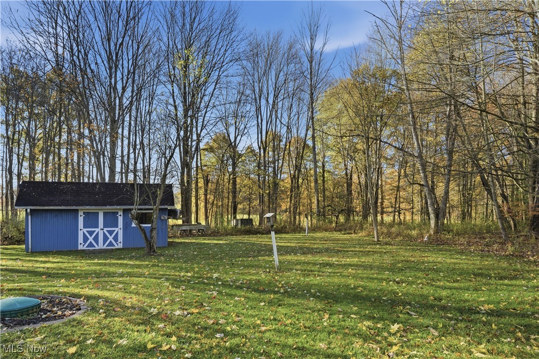 3275 Ranfield Road Kent, OH 44240 - Photo 9 of 33 View of grassy yard featuring an outdoor structure
