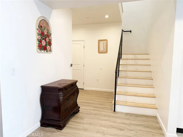 a view of entryway with wooden floor