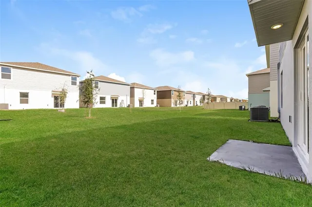 a view of a house with a big yard