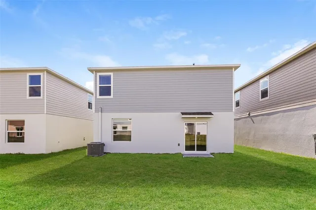a view of a back yard of the house