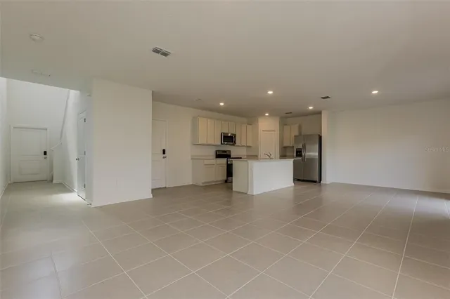 a view of a kitchen with a sink cabinets and window