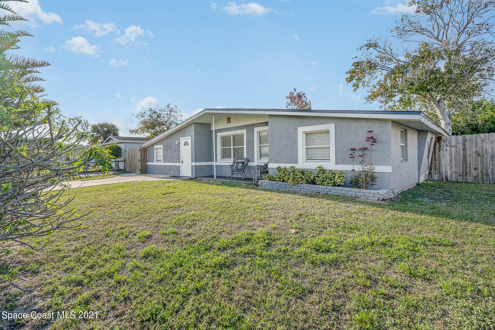 2210 Allan Adale Road Melbourne, FL 32935 - Photo 1 of 23 a front view of a house with garden