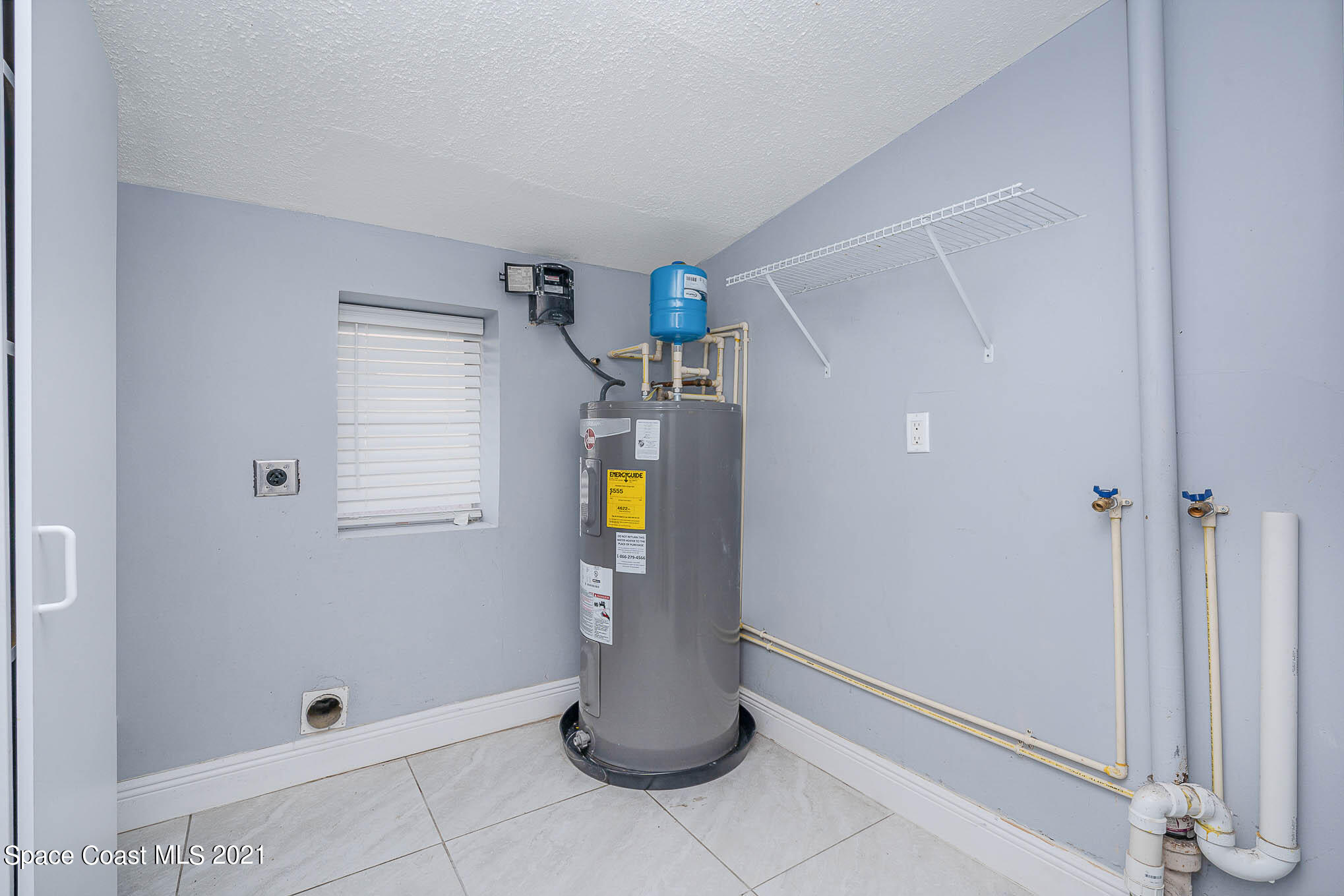 2210 Allan Adale Road Melbourne, FL 32935 - Photo 21 of 23 a view of water heater room