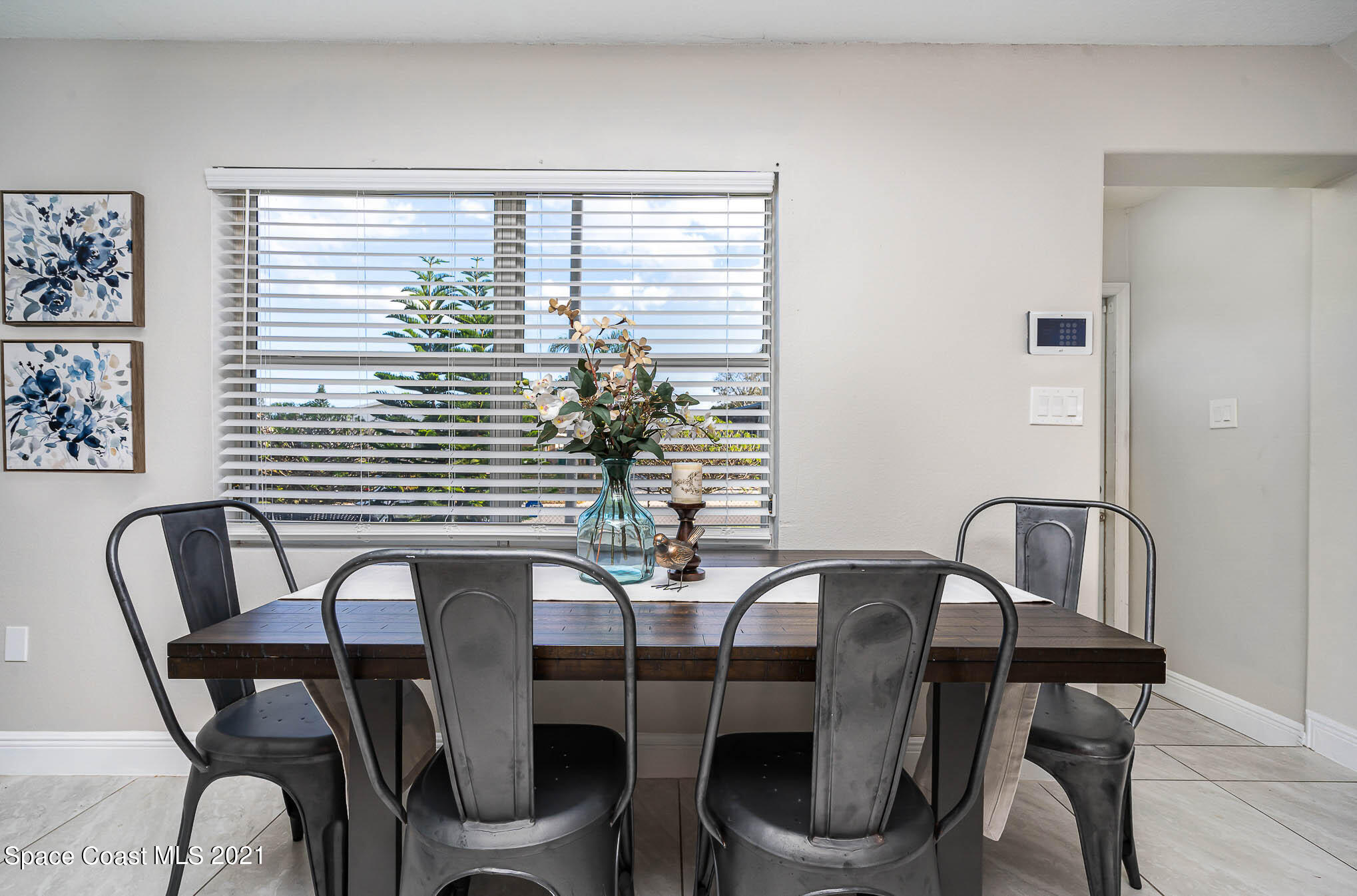 2210 Allan Adale Road Melbourne, FL 32935 - Photo 8 of 23 a view of a dining room with furniture and window