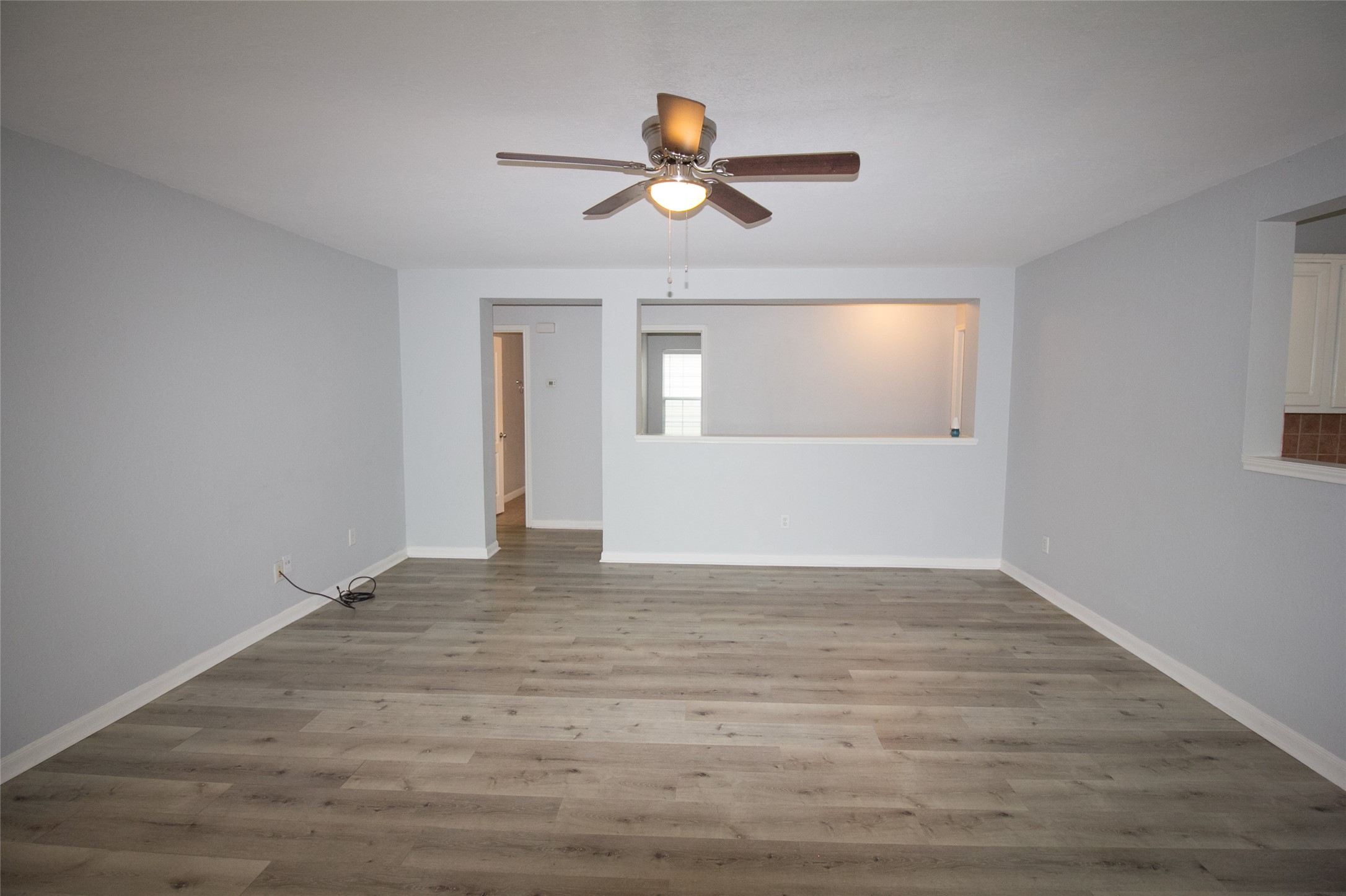 29523 Legends Stone Drive Spring, TX 77386 - Photo 8 of 28 a view of empty room with wooden floor and fan