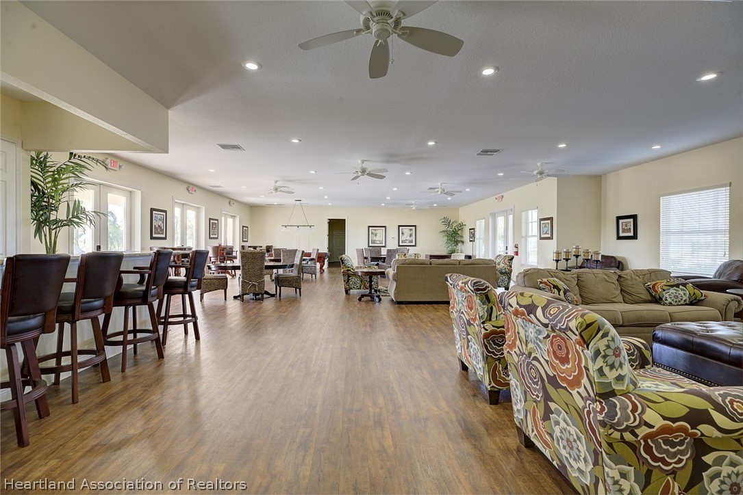 1388 Stone Circle Sebring, FL 33870 - Photo 18 of 31 a living room with lots of furniture and a wooden floor