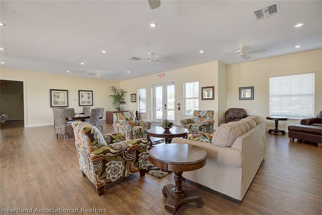 1388 Stone Circle Sebring, FL 33870 - Photo 20 of 31 a living room with furniture and a large window