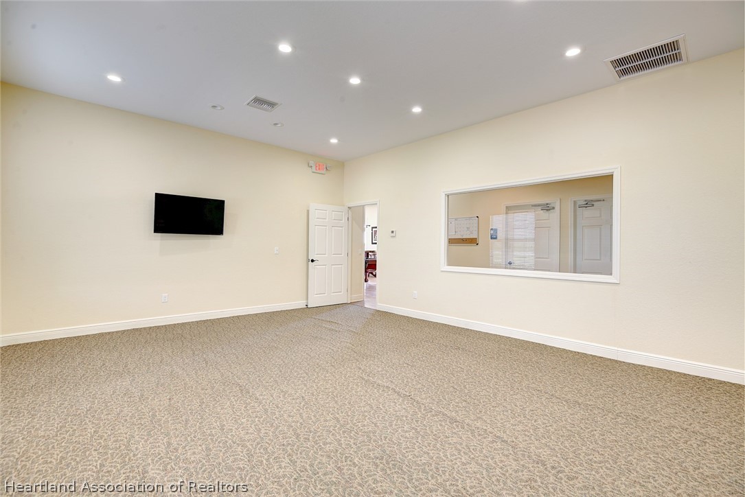 1388 Stone Circle Sebring, FL 33870 - Photo 24 of 31 a view of an empty room with a window