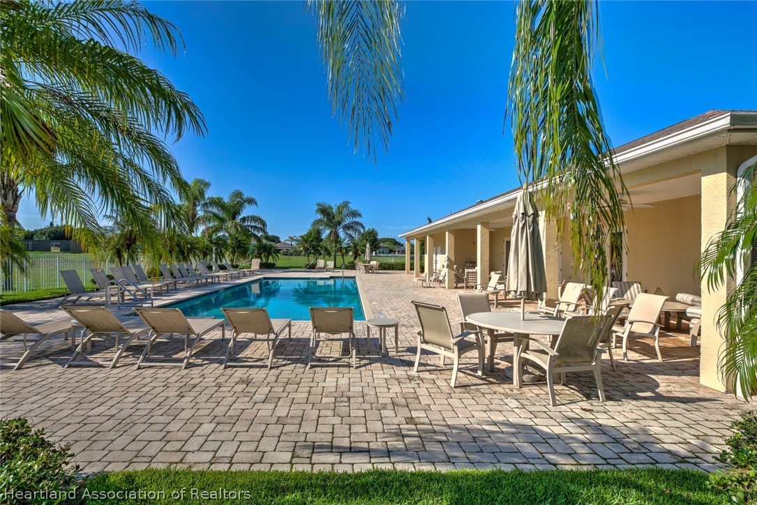 1388 Stone Circle Sebring, FL 33870 - Photo 28 of 31 a view of a house with backyard porch and sitting area