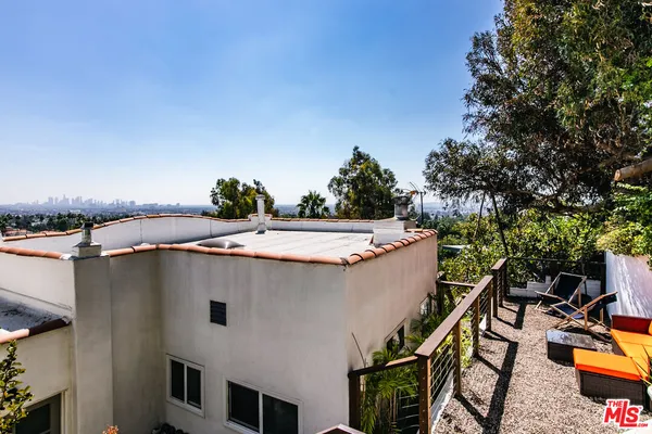 a view of a swimming pool with lounge chair
