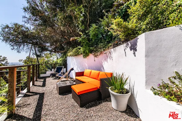 a backyard of a house with seating space