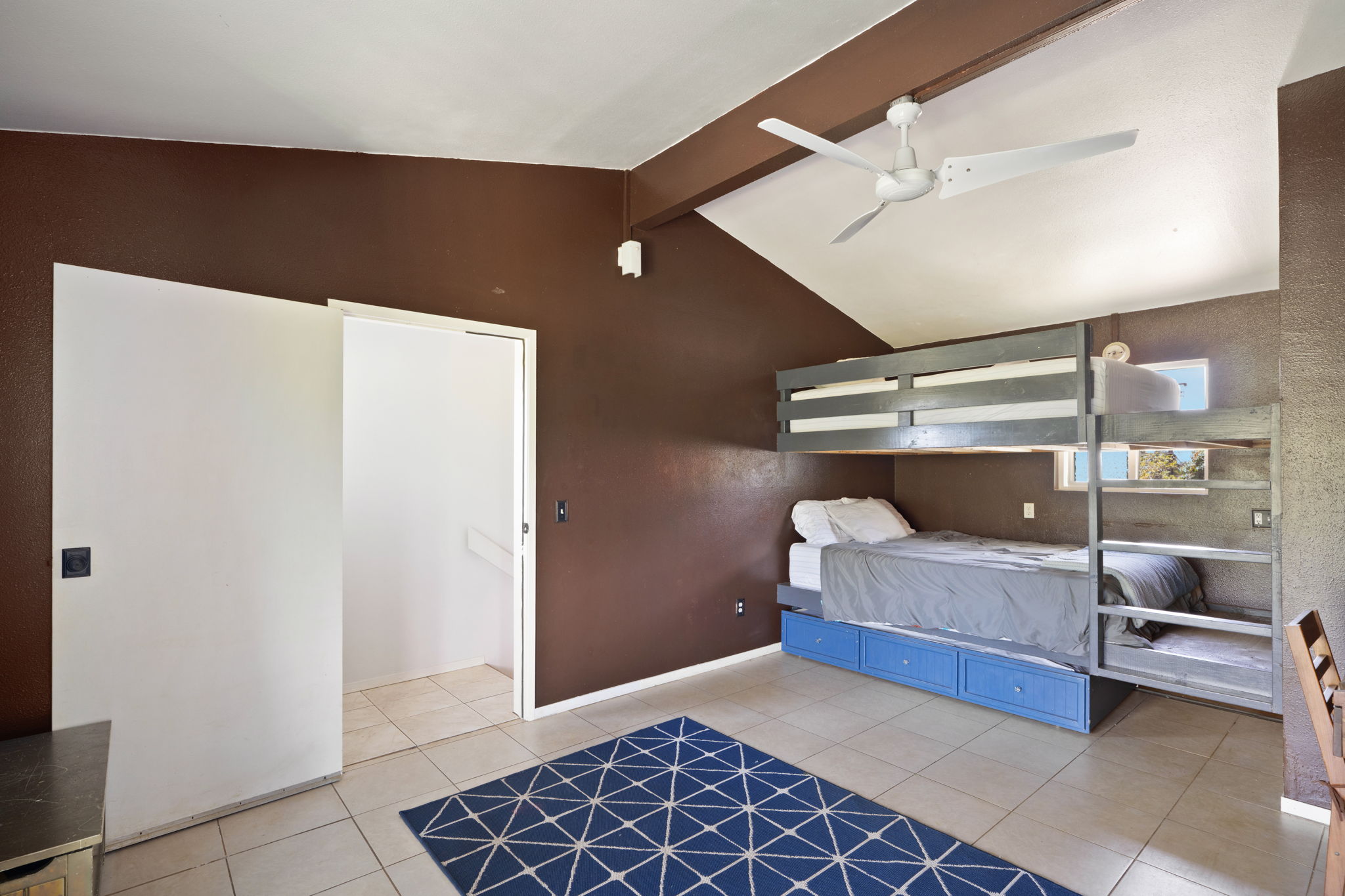 6100 Kawaihau Road Kapaa, HI 96746 - Photo 15 of 22 a bedroom with a bed and a walk in closet