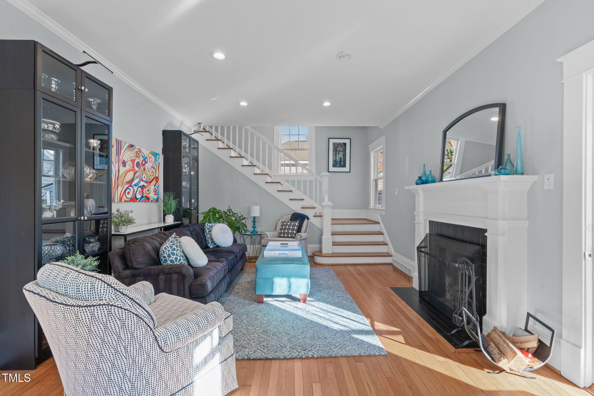 202 Duncan Street Raleigh, NC 27608 - Photo 10 of 46 a living room with furniture and a fireplace
