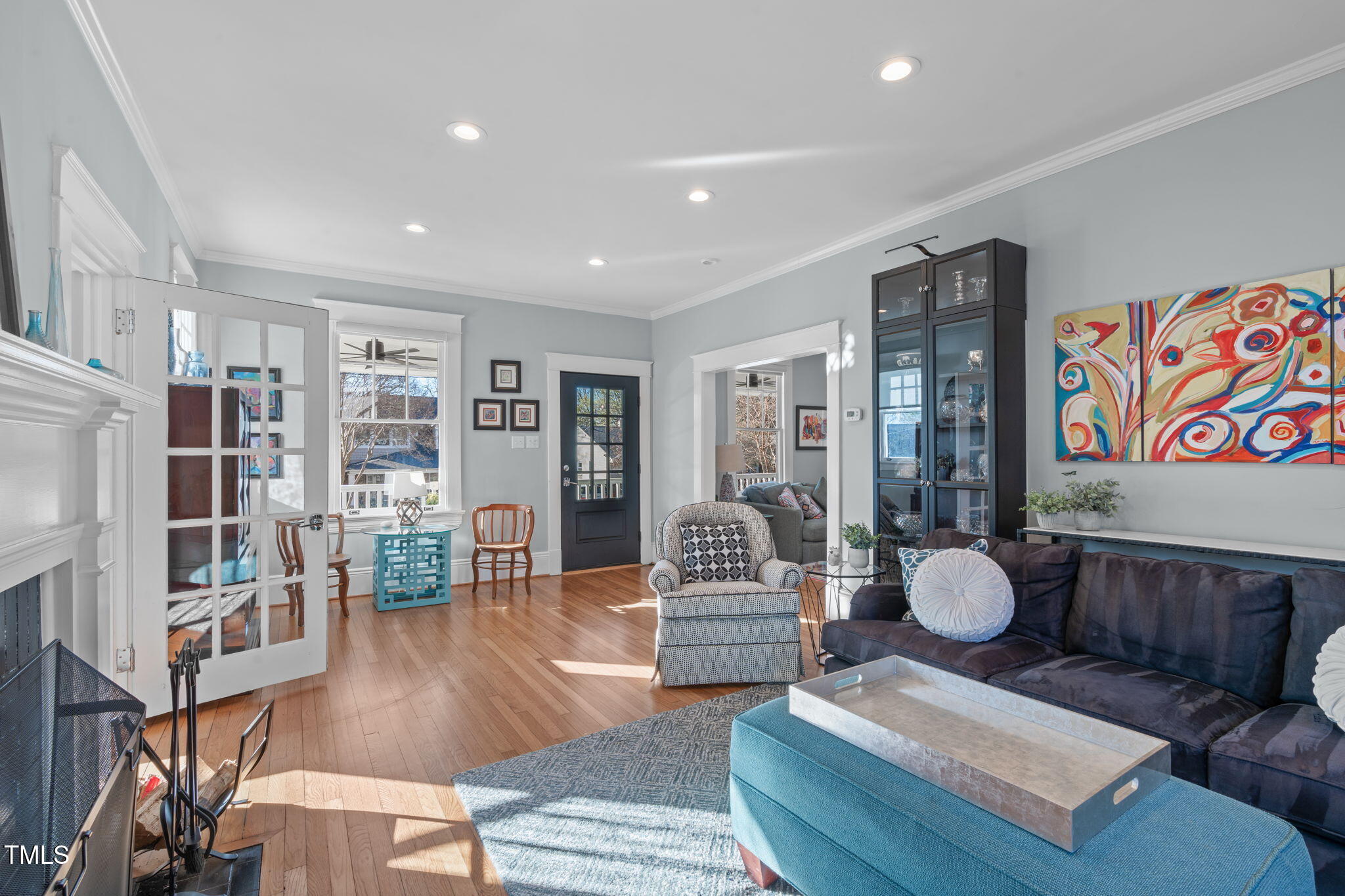 202 Duncan Street Raleigh, NC 27608 - Photo 11 of 46 a living room with furniture and a book shelf