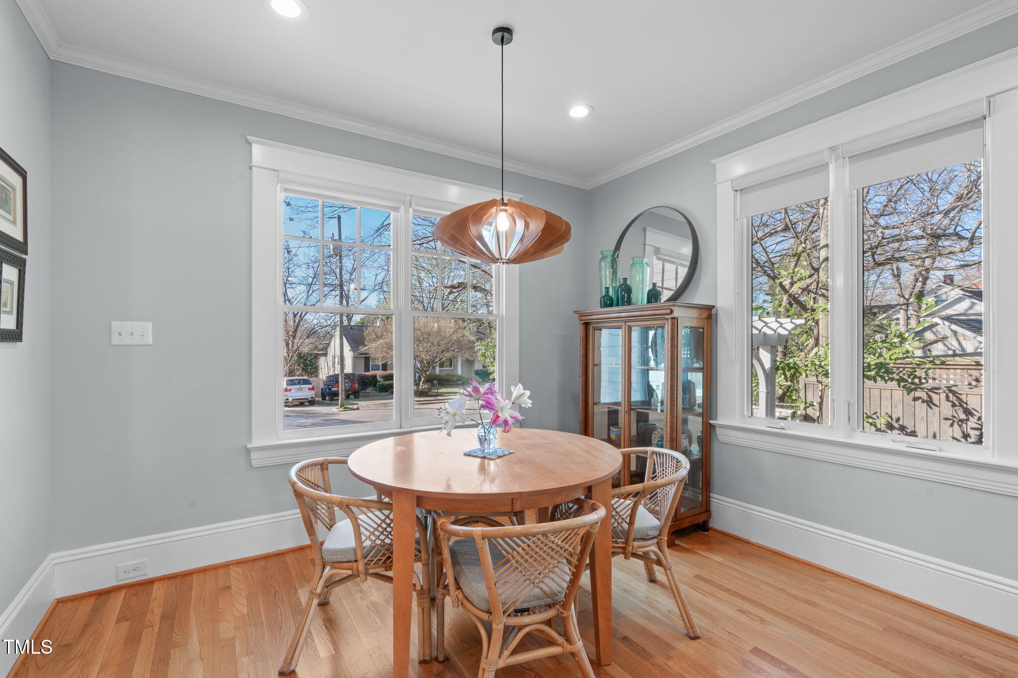 202 Duncan Street Raleigh, NC 27608 - Photo 17 of 46 a dining room with furniture a chandelier and wooden floor