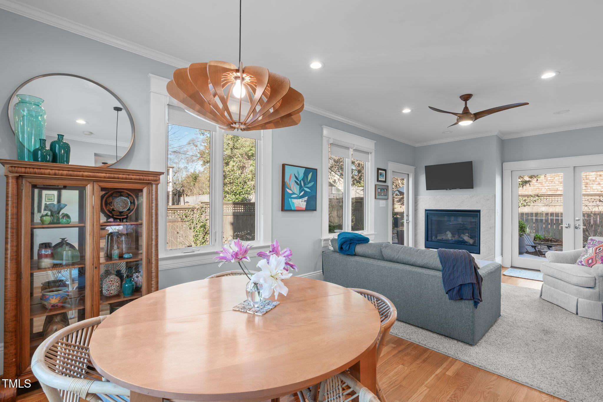 202 Duncan Street Raleigh, NC 27608 - Photo 18 of 46 a living room with furniture a fireplace and a chandelier