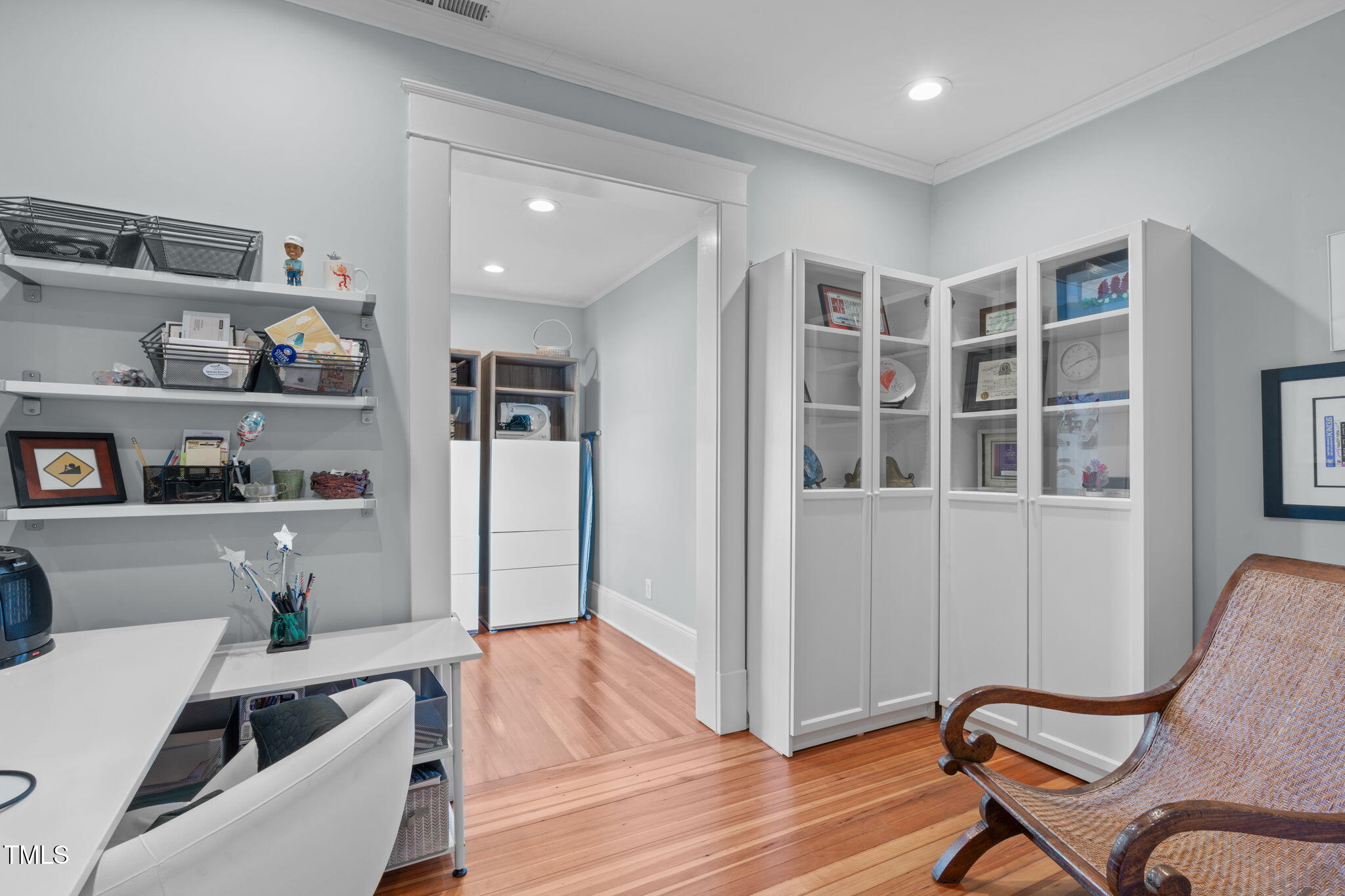 202 Duncan Street Raleigh, NC 27608 - Photo 21 of 46 a living room with furniture and a book shelf