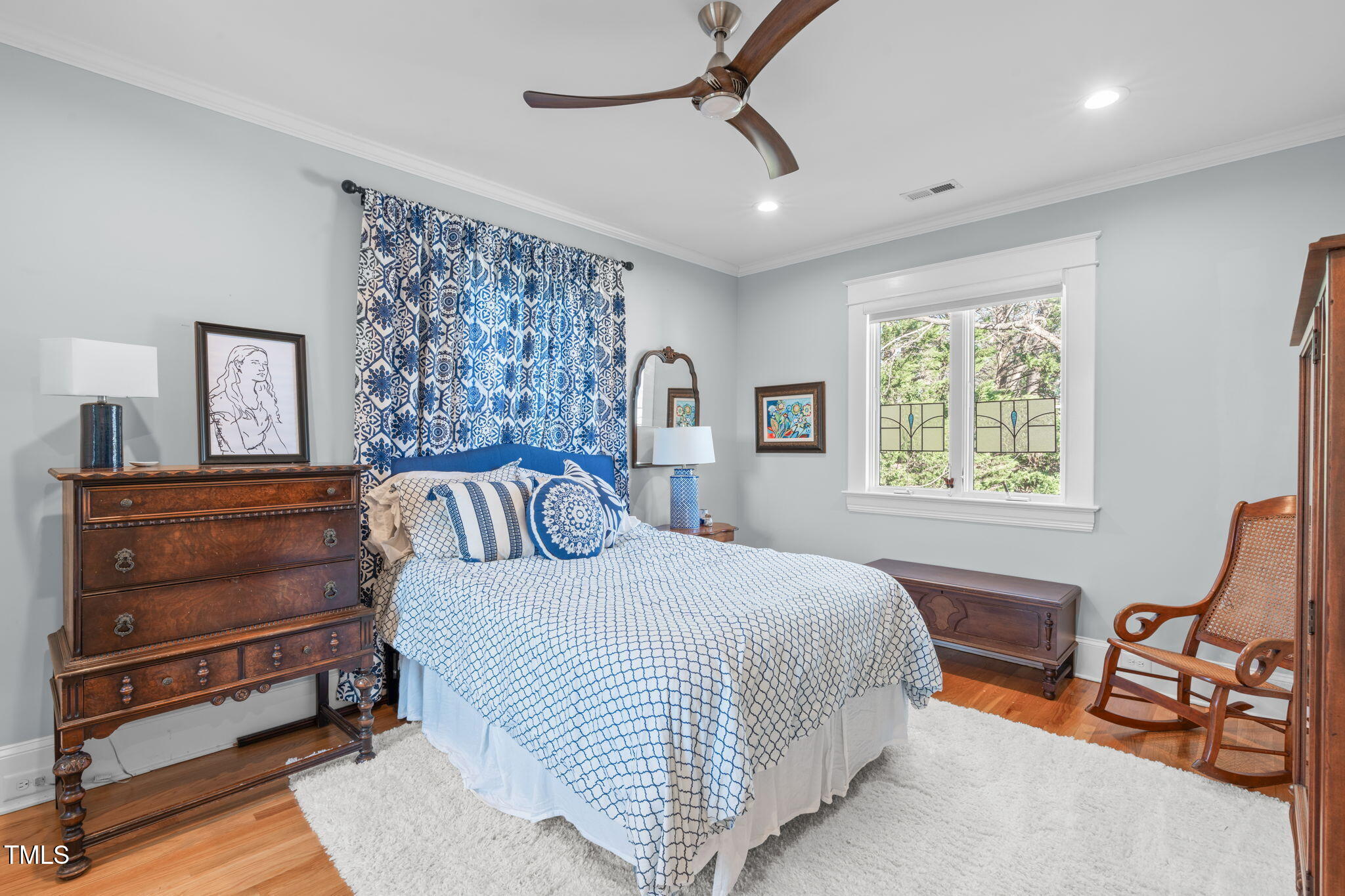 202 Duncan Street Raleigh, NC 27608 - Photo 22 of 46 a bed room with a bed and a chair