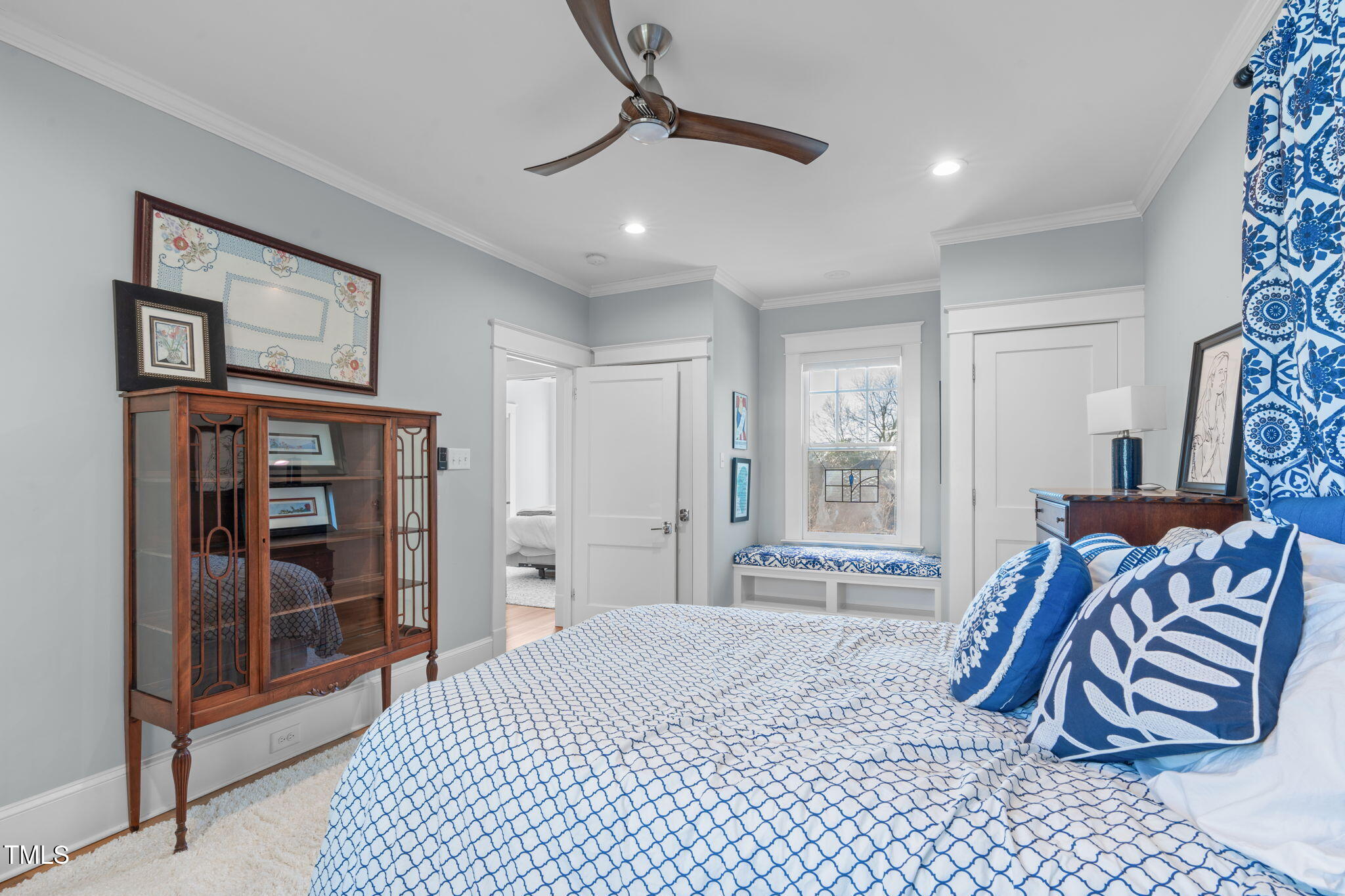 202 Duncan Street Raleigh, NC 27608 - Photo 23 of 46 a bedroom with a bed and a walk in closet