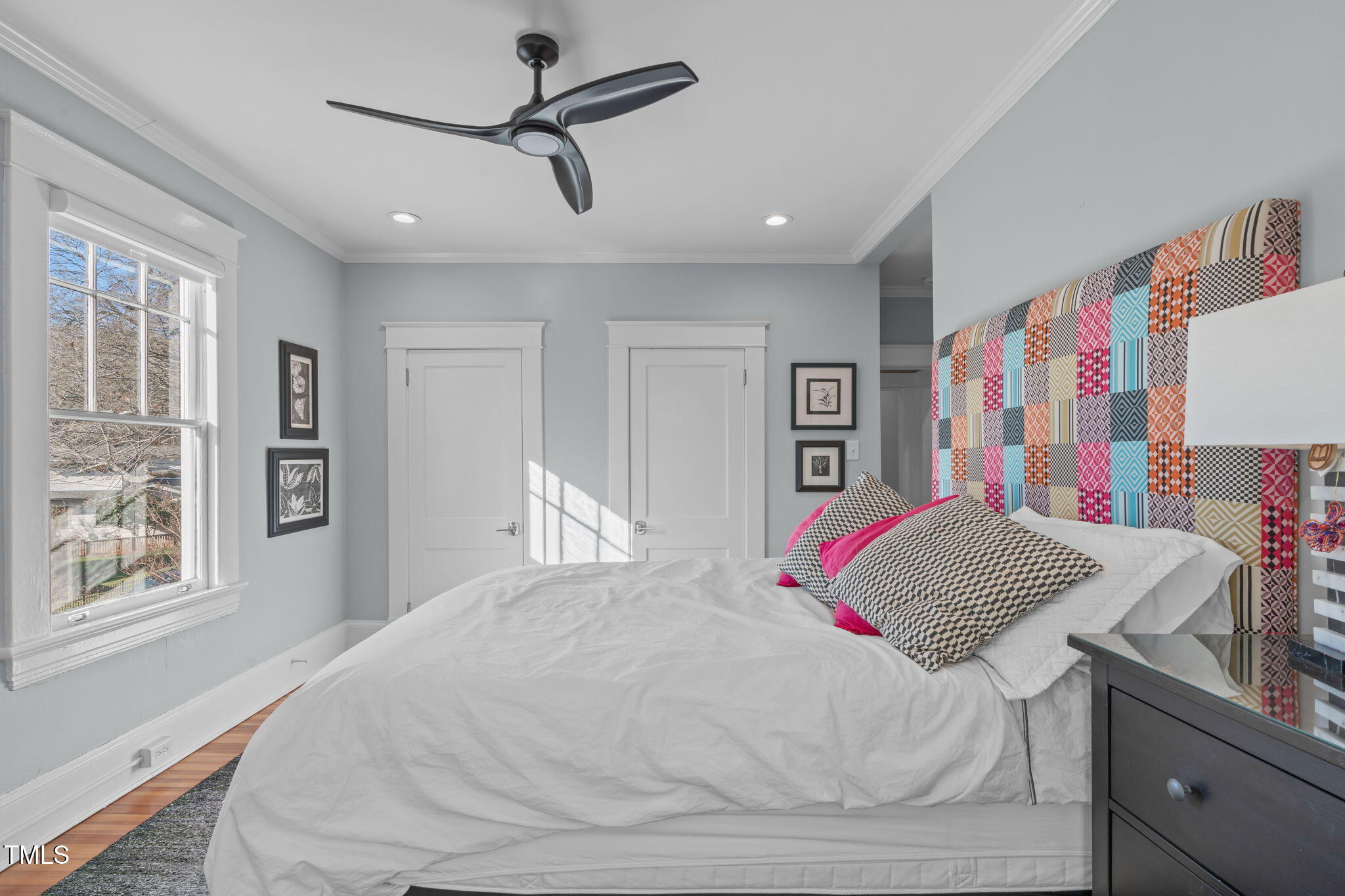 202 Duncan Street Raleigh, NC 27608 - Photo 26 of 46 a bedroom with a large bed and a window