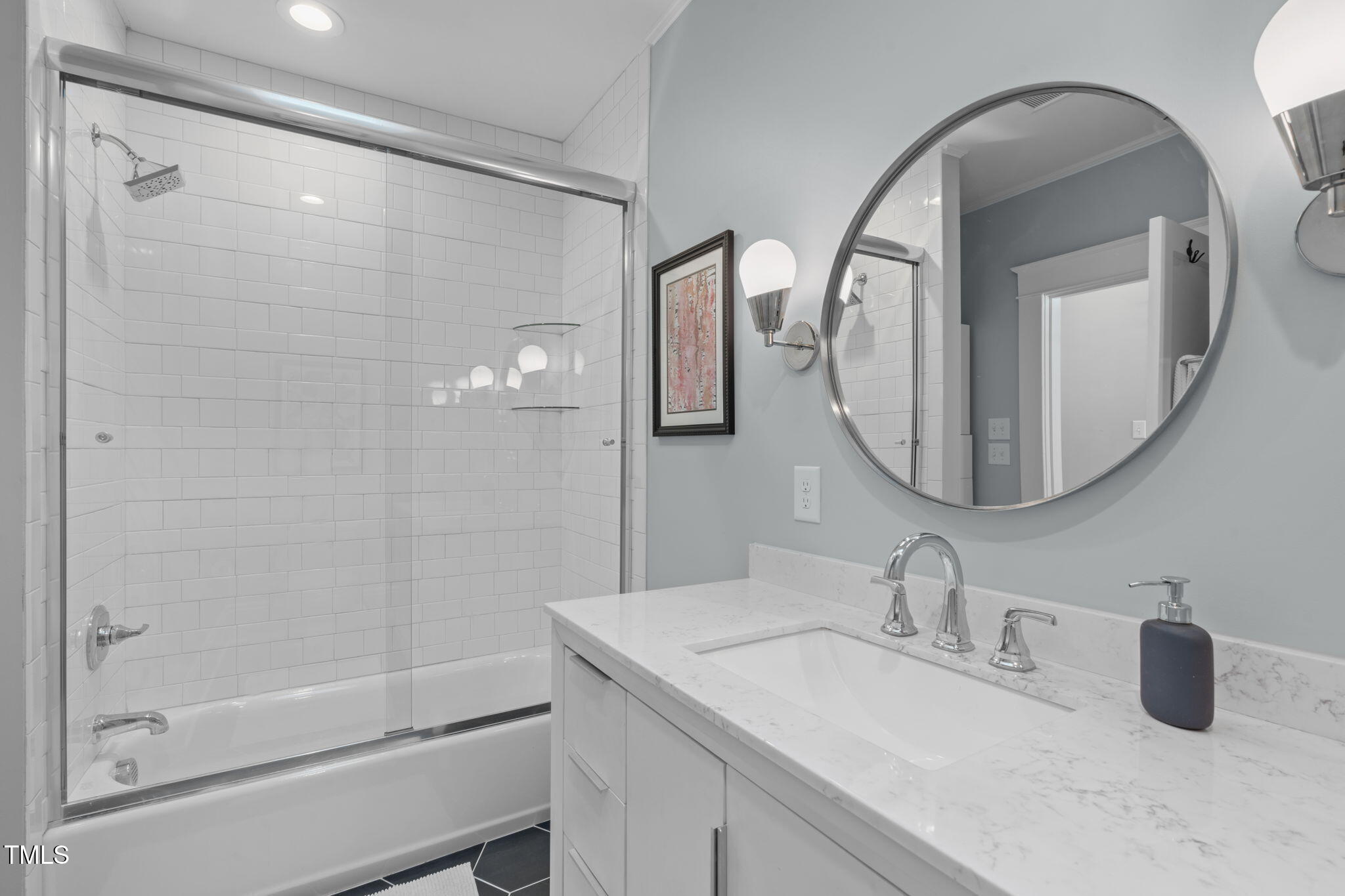 202 Duncan Street Raleigh, NC 27608 - Photo 27 of 46 a bathroom with a sink a toilet and a mirror