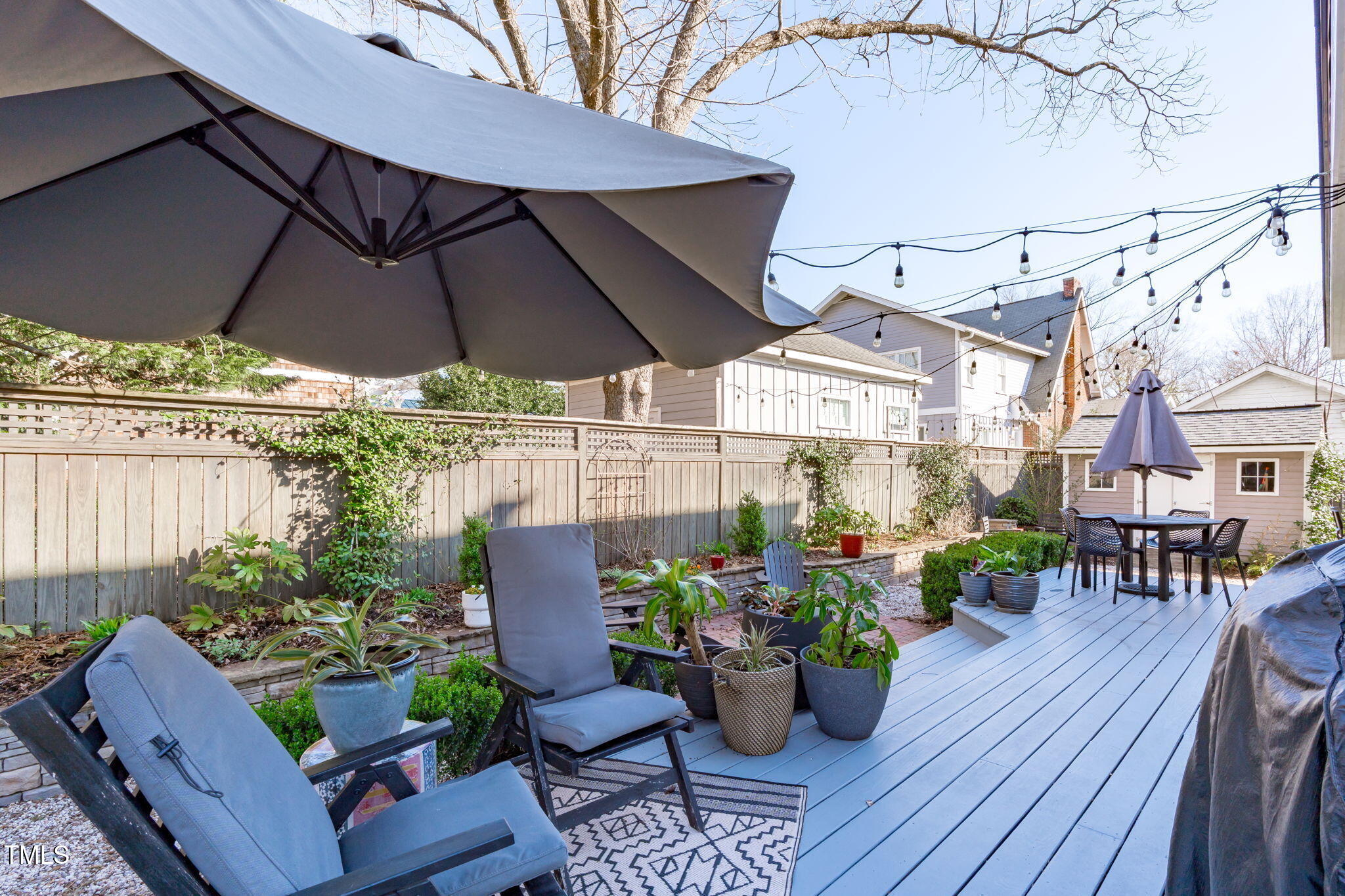 202 Duncan Street Raleigh, NC 27608 - Photo 30 of 46 a view of a table and chairs under an umbrella
