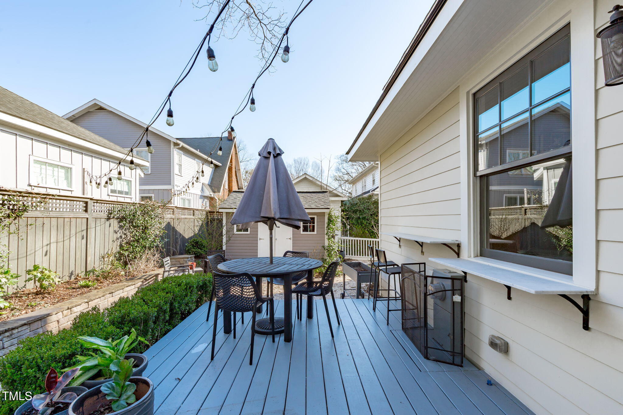 202 Duncan Street Raleigh, NC 27608 - Photo 31 of 46 a view of a house with backyard and sitting area