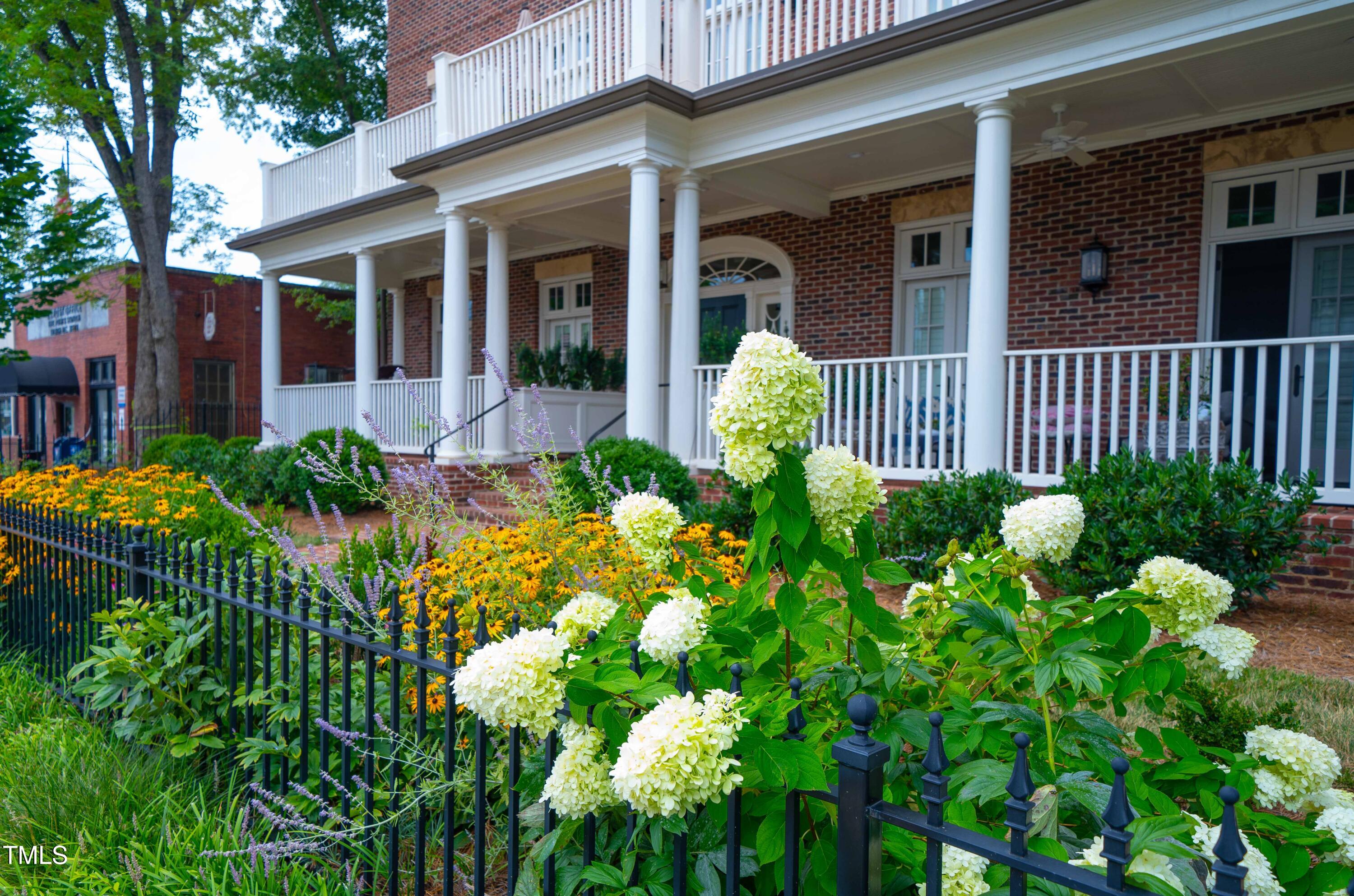 202 Duncan Street Raleigh, NC 27608 - Photo 39 of 46 a view of a house with a flower garden