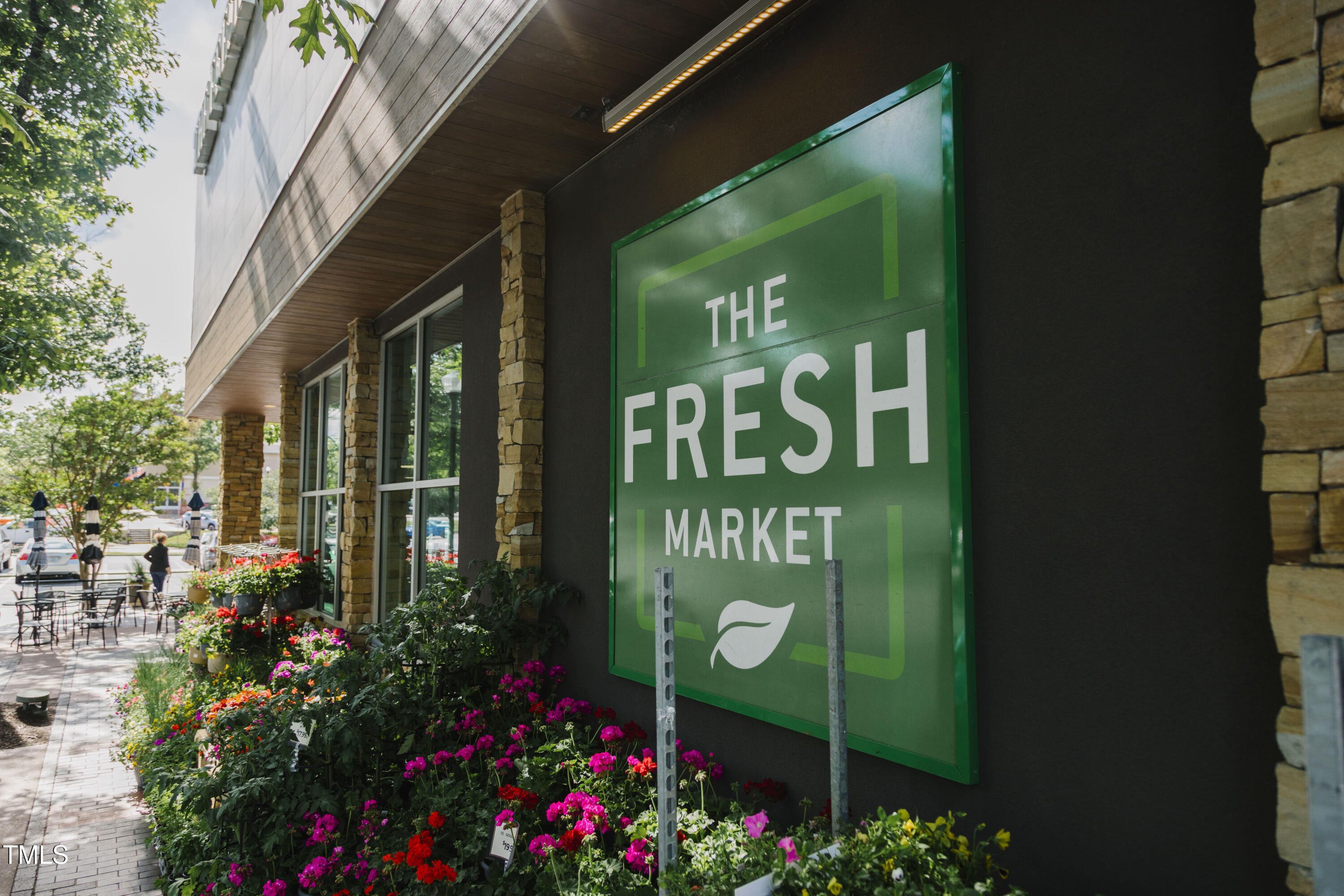 202 Duncan Street Raleigh, NC 27608 - Photo 42 of 46 a sign that is sitting on a brick wall
