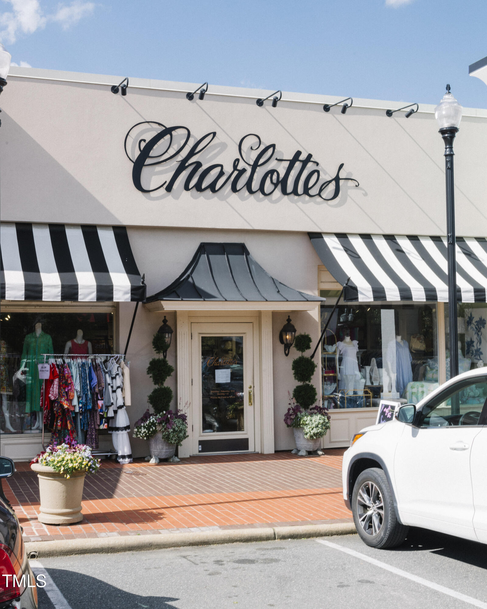 202 Duncan Street Raleigh, NC 27608 - Photo 43 of 46 a view of a cars park in front of a store