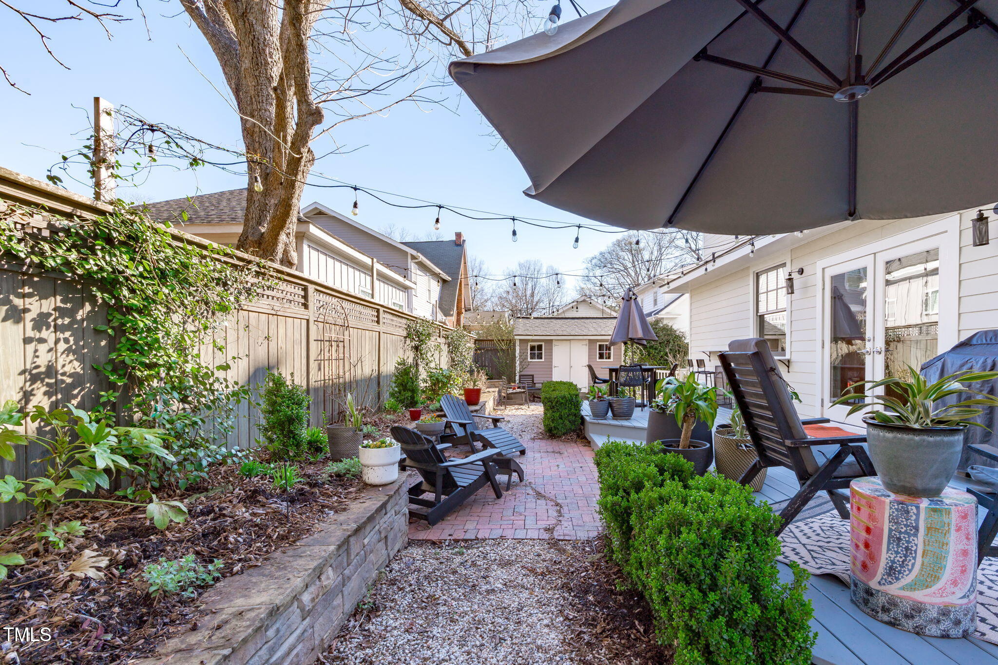 202 Duncan Street Raleigh, NC 27608 - Photo 5 of 46 a view of a backyard with sitting area and furniture