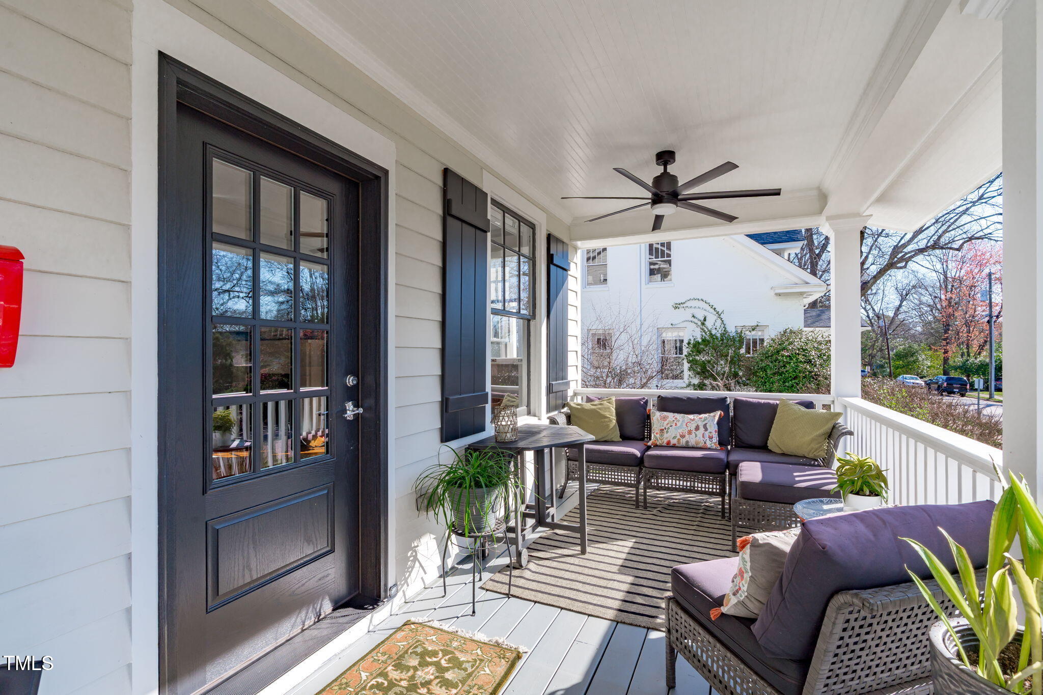 202 Duncan Street Raleigh, NC 27608 - Photo 7 of 46 a living room with furniture a floor to ceiling window and wooden floor