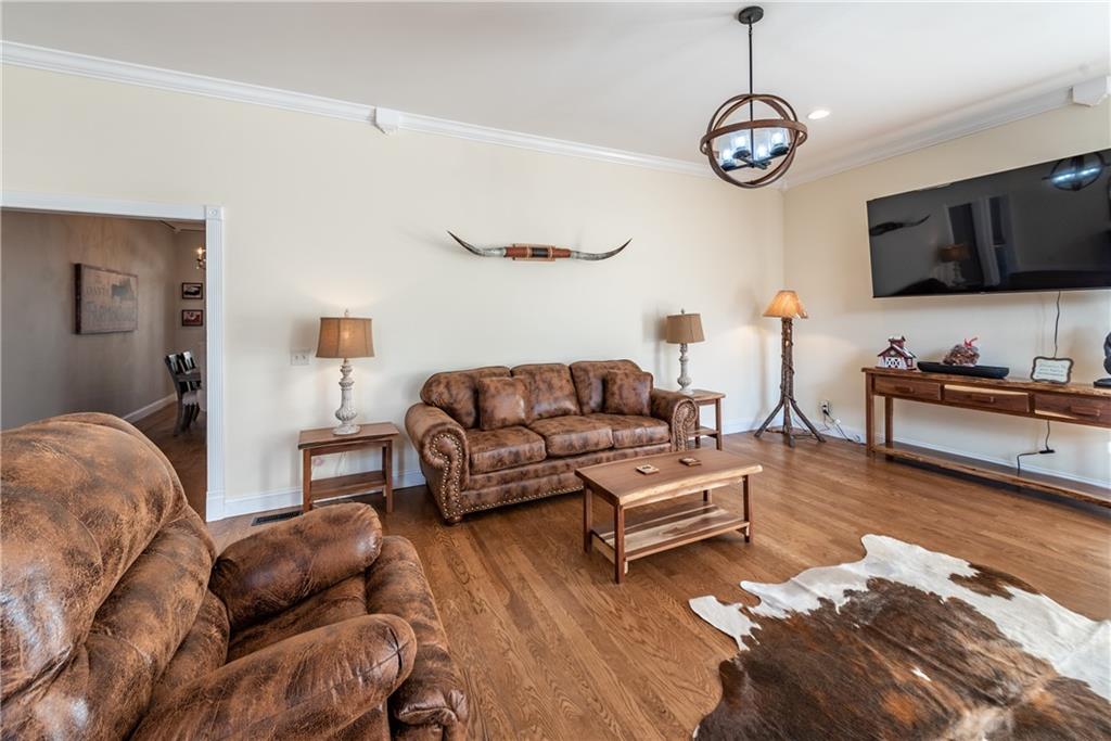 33-t J T J Mote Road Dahlonega, GA 30533 - Photo 23 of 59 a living room with furniture a flat screen tv and kitchen view