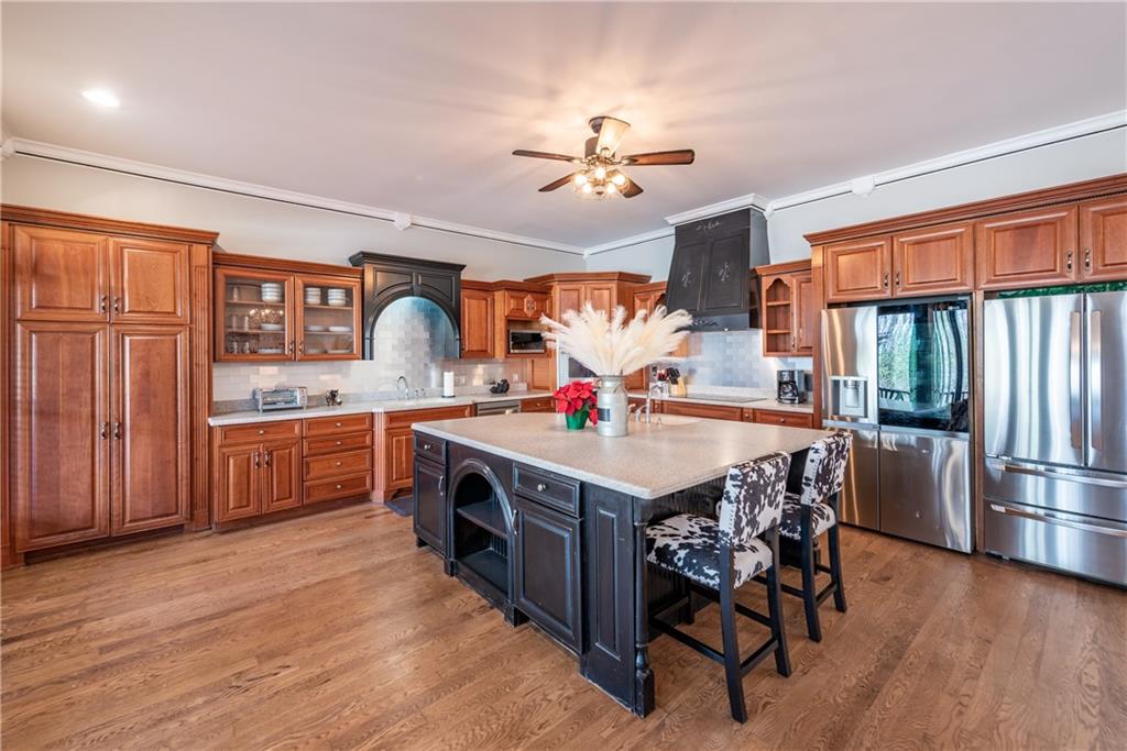 33-t J T J Mote Road Dahlonega, GA 30533 - Photo 25 of 59 a kitchen with a table chairs refrigerator and cabinets