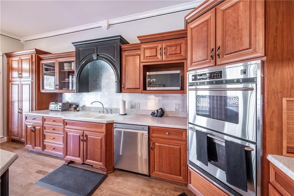 33-t J T J Mote Road Dahlonega, GA 30533 - Photo 29 of 59 a kitchen with stainless steel appliances granite countertop a stove microwave and cabinets