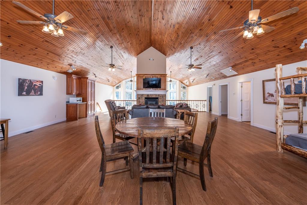 33-t J T J Mote Road Dahlonega, GA 30533 - Photo 34 of 59 a view of a dining room with furniture wooden floor and chandelier