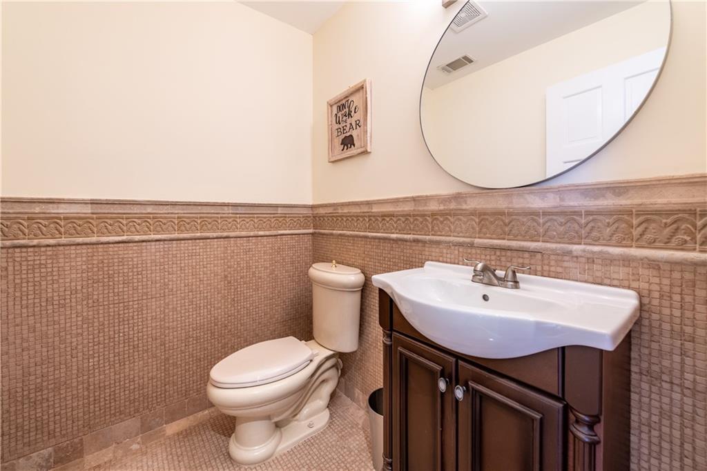 33-t J T J Mote Road Dahlonega, GA 30533 - Photo 49 of 59 a bathroom with a sink a mirror and a toilet