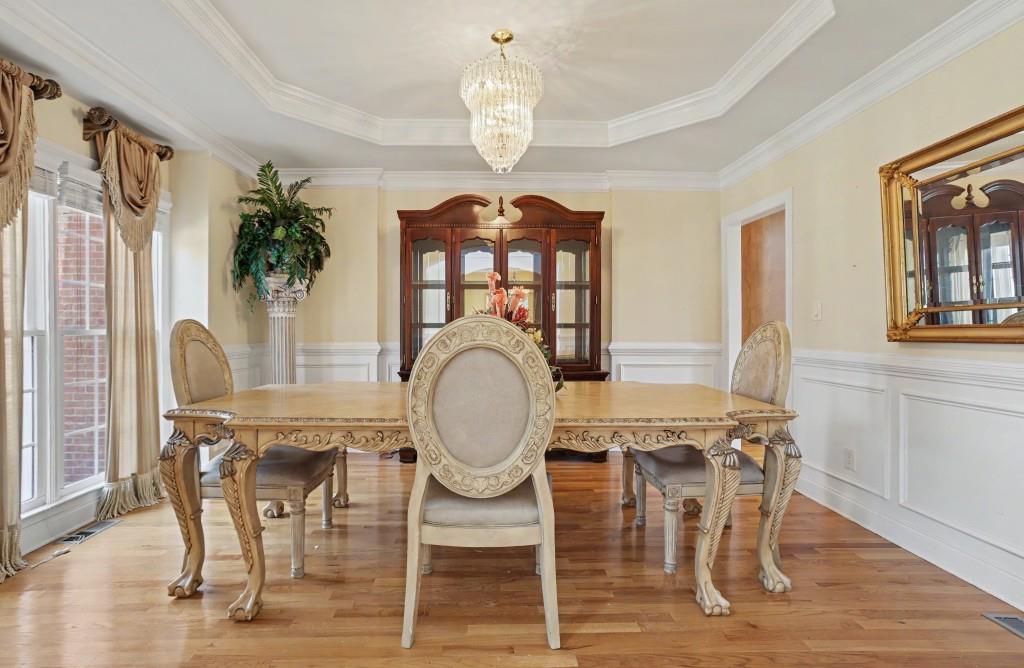 2123 Floral Ridge Drive Dacula, GA 30019 - Photo 12 of 56 a view of a dining room with furniture window and wooden floor