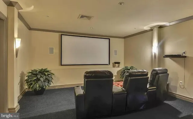 a room with furniture and a potted plant