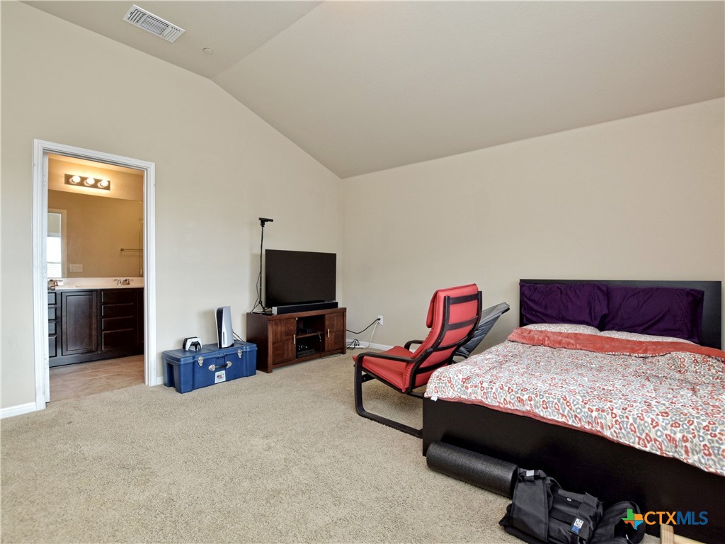 516 East Slaughter Lane, Unit 1801 Austin, TX 78744 - Photo 18 of 30 a living room with furniture and a flat screen tv