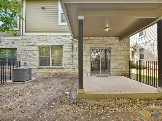 a view of yellow house with a large window