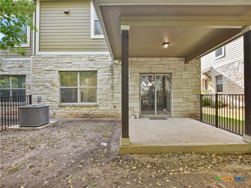 516 East Slaughter Lane, Unit 1801 Austin, TX 78744 - Photo 25 of 30 a view of yellow house with a large window