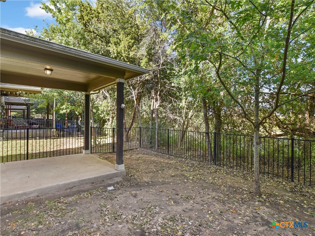 516 East Slaughter Lane, Unit 1801 Austin, TX 78744 - Photo 26 of 30 a view of backyard with green space