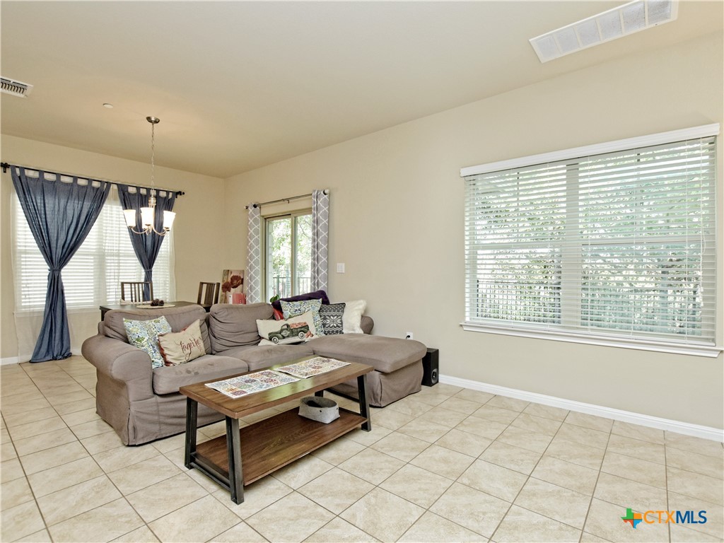 516 East Slaughter Lane, Unit 1801 Austin, TX 78744 - Photo 8 of 30 a living room with furniture and a window