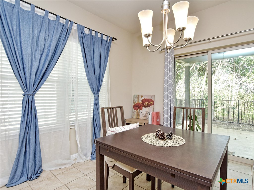 516 East Slaughter Lane, Unit 1801 Austin, TX 78744 - Photo 10 of 30 a view of a dining room with furniture window and outside view