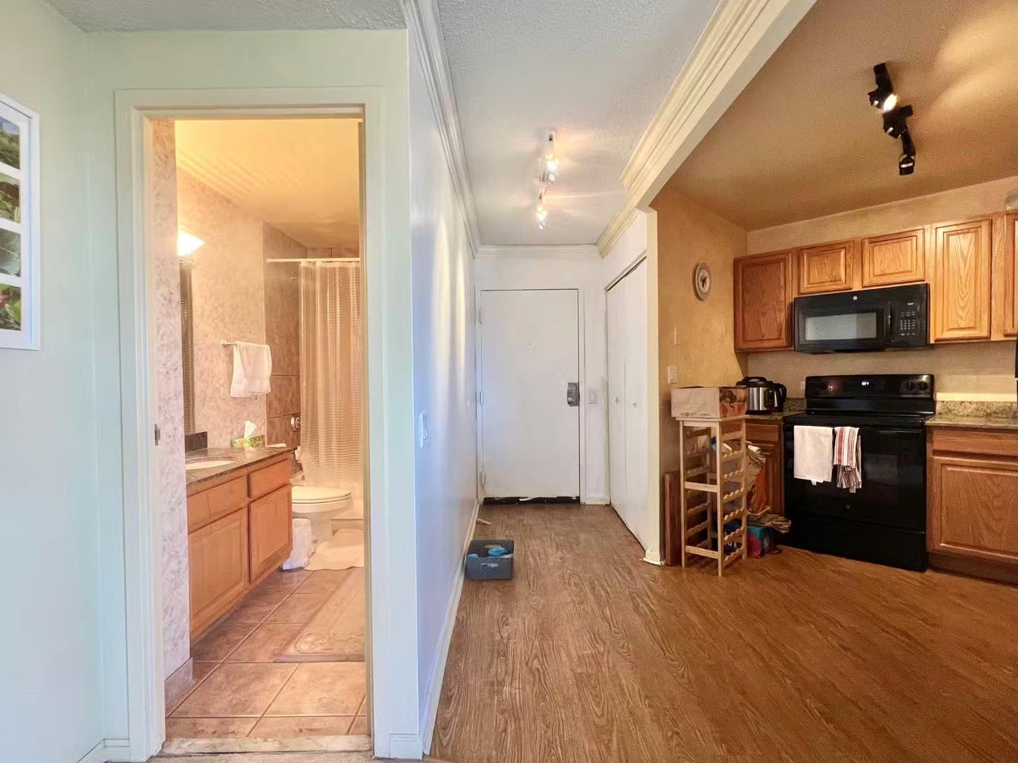 5320 North Sheridan Road, Unit 2203 Chicago, IL 60640 - Photo 5 of 27 a view of a hardwood floor and a kitchen