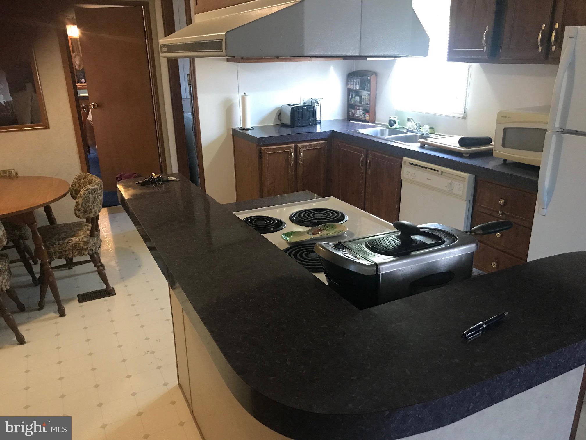 Kitchen island with stove and range hood