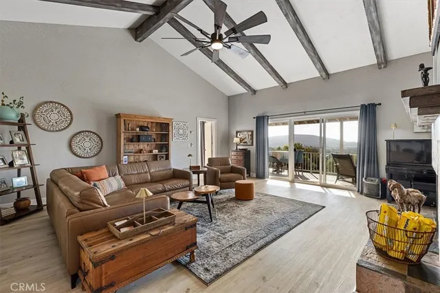 a bedroom with a bed and ceiling fan